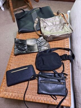6 black/gold and silver bags. Including The Sak, Steve Madden and Express.